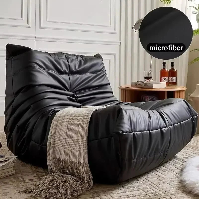 Black low profile lounge module with matching throw