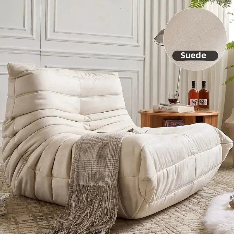 Cream low profile lounge module with rounded cushion form